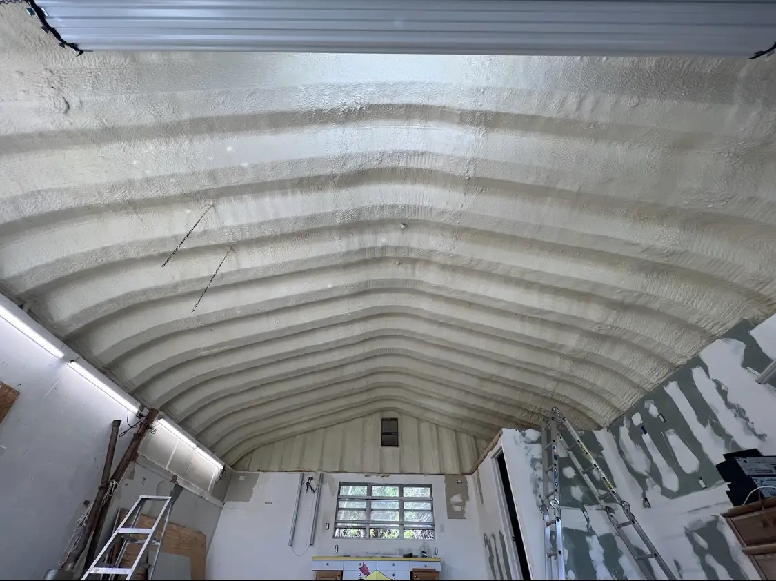 Spray polyurethane foam applied to the underside of a metal roof deck in Worcester